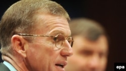 General Stanley McChrystal testifies as the U.S. ambassador to Kabul, Karl Eikenberry, looks on.