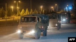 Turkish soldiers drive toward the border with Syria near Akcakale in Sanliurfa Province on October 8.