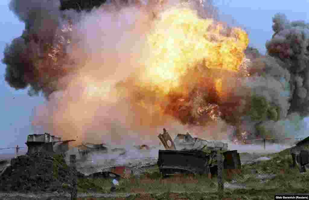 Flames erupt from a blast that demolishes a decommissioned SS-24 nuclear missile at a military base in the southern Ukrainian town of Pervomaysk on September 29, 1998.