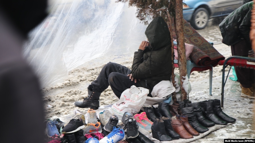 Street vendors brave the cold in Kabul on January 12.