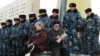 Kazakh police bar demonstrators access to the presidential residence in Astana in March.