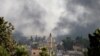 Smoke rises over the Syrian town of Tel Abyad, as seen from the Turkish border town of Akcakale in Sanliurfa province, Turkey, October 10, 2019.