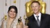 U.S. -- Directors Sharmeen Obaid-Chinoy (L) and Daniel Junge, winners of the Best Documentary Short Subject for the film "Saving Face", pose with their Oscars during the 84th Academy Awards in Hollywood, 26Feb2012