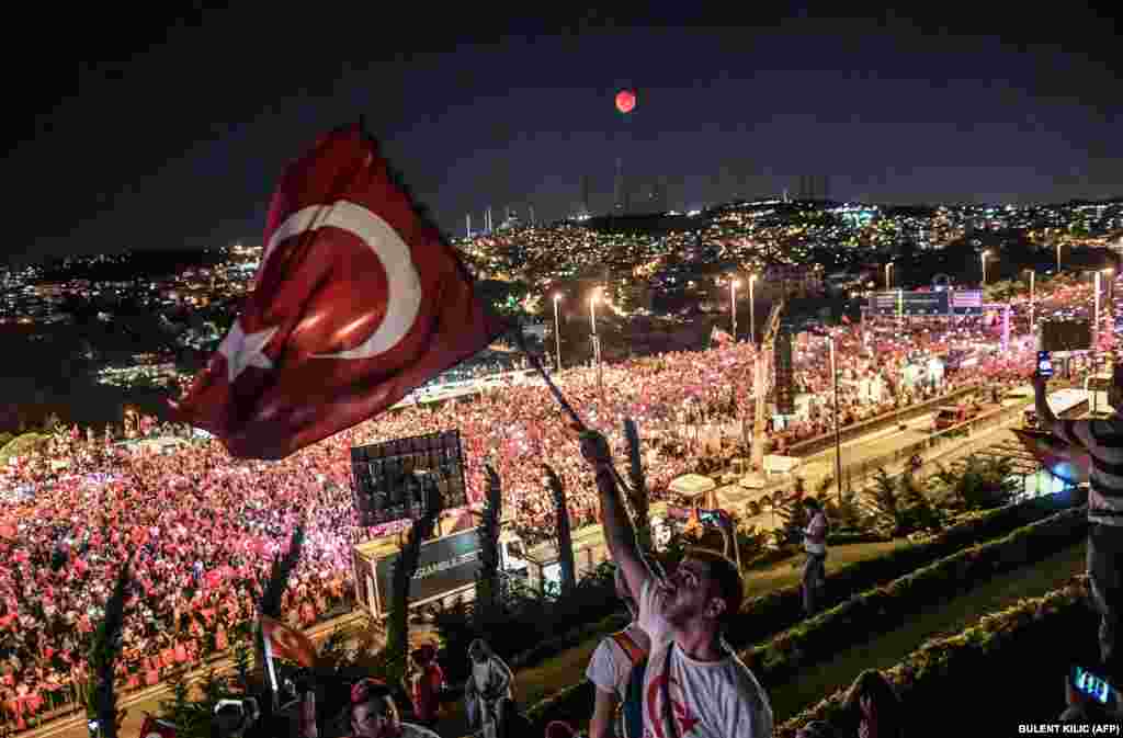 People gather on Martyrs Bridge in Istanbul to attend the second anniversary of the defeat of an attempted coup. (AFP/Bulent Kilic)