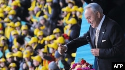 Kazakh President Nursultan Nazarbaev gestures during a ceremony to mark the Day of the First President in Astana on December 1.