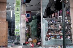 A looted souvenir shop after a night of protest on June 2 in Manhattan is the image Russian TV wants to show.
