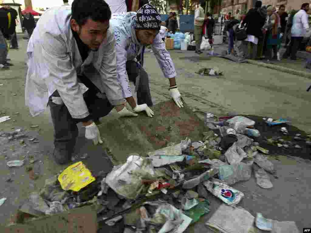 Medical students who treated the wounded during the uprising clean a section of Cairo's Tahrir Square on February 12.