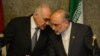 File photo - During a brief period of a thaw in relations Egyptian foreign minister Mohammed Kamel Amr (L) talks with Iranian Foreign Minister Ali Akbar Salehi (R) during a joint press conference after their first high-level meeting on the Syria conflict on Monday in Cairo