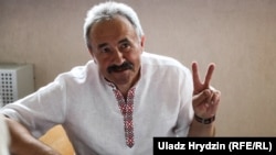 Belarusian union leader Henadz Fyadynich gestures in court on July 30
