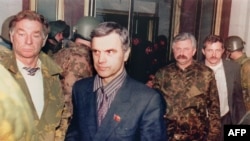 Russia -- Former Soviet Parliament Chairman Ruslan Khasbulatov (2nd-L) and former Parliament Vice-President Alexander Rutskoi (3rd-R) are guarded by members of "Team Alpha" special forces after being arrested, Moscow, 04 October 1993 