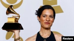 Neela Vaswani poses with the award for Best Children's Album for " I Am Malala: How One Girl Stood Up For Education And Changed The World (Malala Yousafzai)" backstage at the 57th annual Grammy Awards in Los Angeles on February 8.