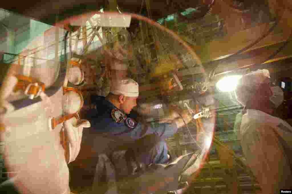 International Space Station crew member and Russian cosmonaut Oleg Novitsky is seen inside the Soyuz spacecraft during training at Baikonur Cosmodrome. (Reuters/Sergei Remezov)