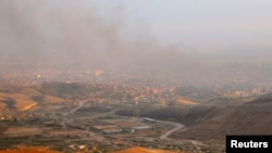 Облако дыма после авиаударов сил коалиции по объектам в Ираке. 22 декабря 2014 года. Иллюстративное фото.