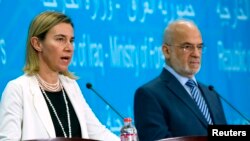 المسؤولة الأوروبية فيديريكا موغيريني ووزير الخارجية العراقي إبراهيم الجعفري