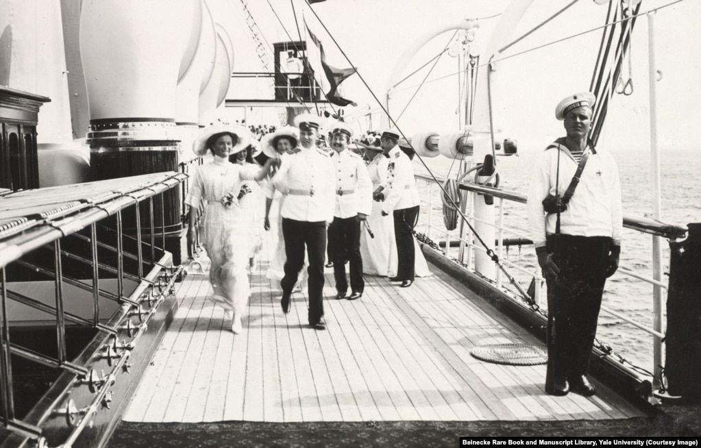 The grand duchesses striding across the deck of the Standart. Life on board the yacht was relaxed and informal, and flirtations sprang up between the sailors and the grand duchesses.&nbsp;