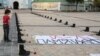 49 пар взуття на площі перед Софією Київською у пам'ять про загиблих десантників і членів екіпажу літака ЗСУ Іл-76, збитого у ніч на 14 червня 2014 року російськими гібридними силами над аеропорт Луганська пострілом із ЗРК. Київ, 14 червня 2019 року