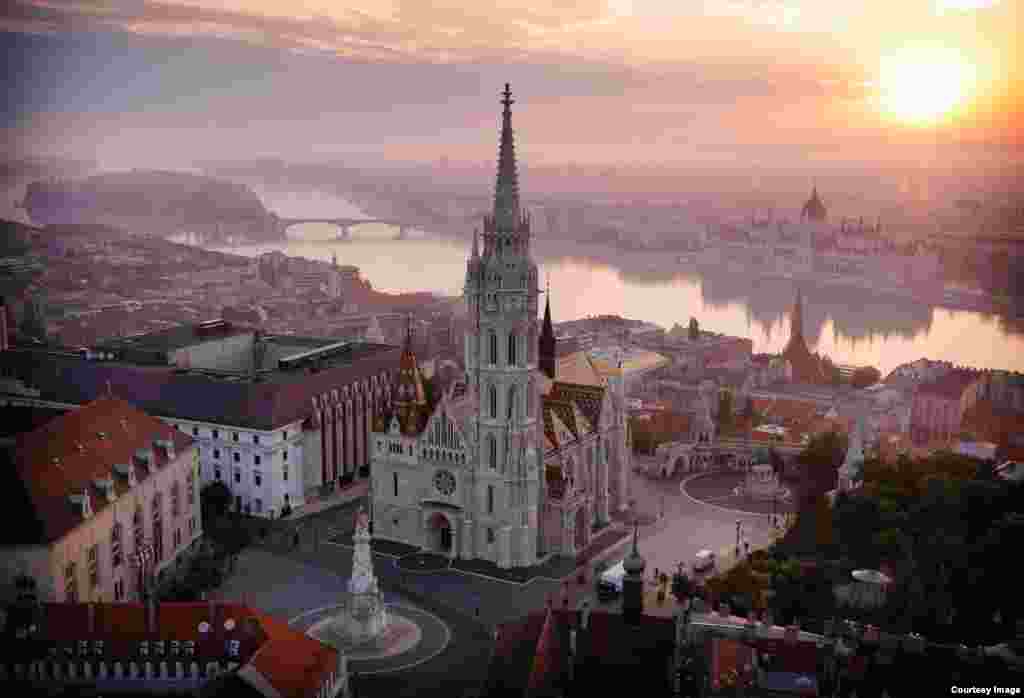 Matthias Church stands on a hilltop overlooking Budapest. Hungarian kings were crowned inside the ancient stone church, which was extensively damaged during the 1945 Allied siege of Budapest. Repairs were only completed in the 1980s.