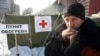  A homeless man stands outside a temporary shelter in the Ukrainian city of Donetsk
