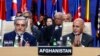 FILE: Afghan President Ashraf Ghani (R) and Afghanistan's Chief Executive Abdullah Abdullah applaud during a session at the NATO Summit in Warsaw in July 2016. 