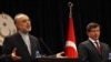 Iranian Foreign Minister Ali Akbar Salehi (left) and his Turkish counterpart, Ahmet Davutoglu, attend a news conference in Ankara on October 21.