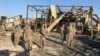 U.S. soldiers inspect the site where an Iranian missile hit at the Ain al-Asad Air Base in Iraq on January 13.