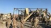 U.S. soldiers inspect the site where an Iranian missile hit at Ain al-Asad air base in Anbar province, January 13, 2020