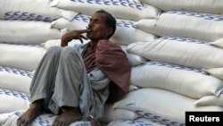 Waiting for the market to open in Karachi