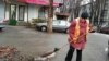 Moldova - woman sweeper, broom, street, Chisinau, 21Jan2013