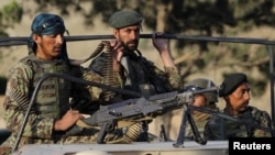 Afghanistan -- Afghan National Army soldiers arrive at the site of an attack on the outskirts of Kabul, 22Jun2012