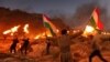 Iraqi Kurds wave Kurdish flags and hold burning torches as they walk up a mountain during a gathering to show support for the upcoming independence referendum and encourage people to vote in the town of Akra, some 500 kilometres north of Baghdad, 