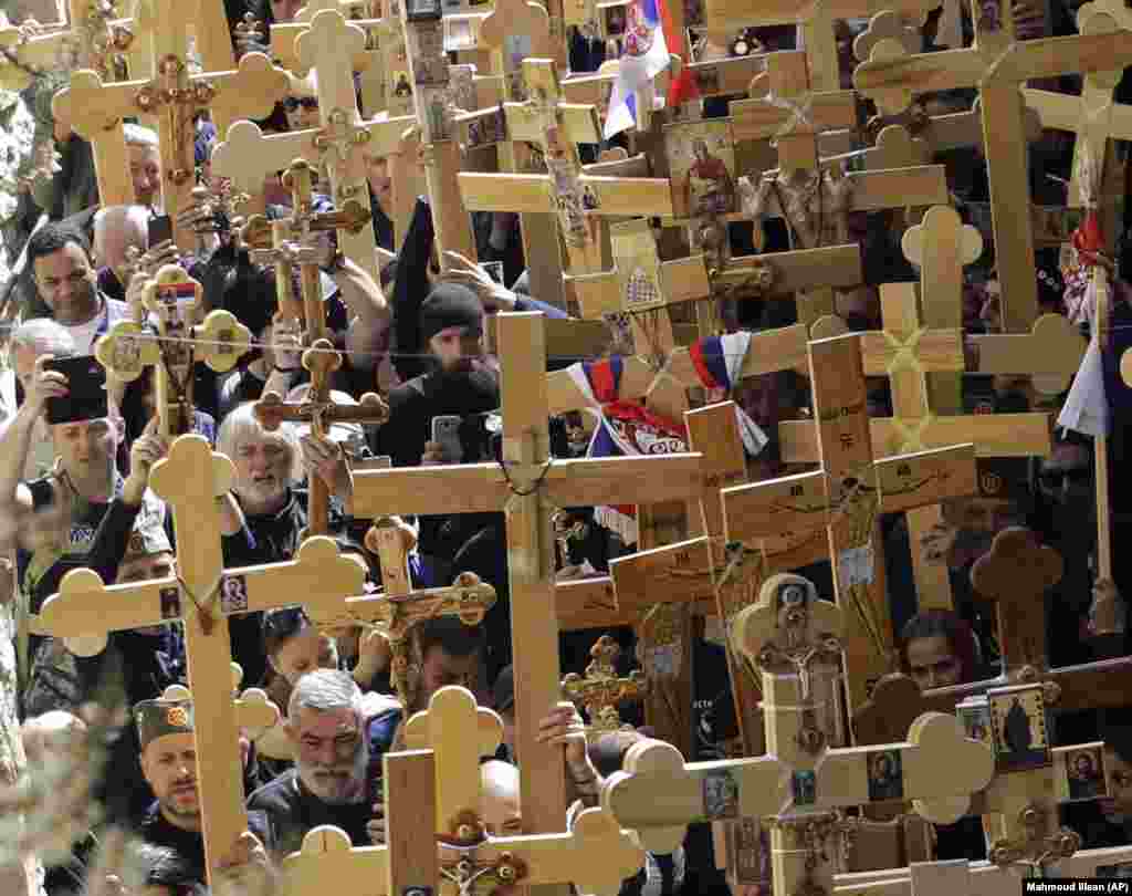 Serbian Orthodox pilgrims hold crosses during a Good Friday procession in Jerusalem on April 26. (AP/Mahmoud Illean)