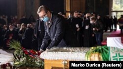 Serbian President Aleksandar Vucic pays his respects at the casket of Serbia's late patriarch, Irinej, at the Church of St. Sava in Belgrade on November 22.