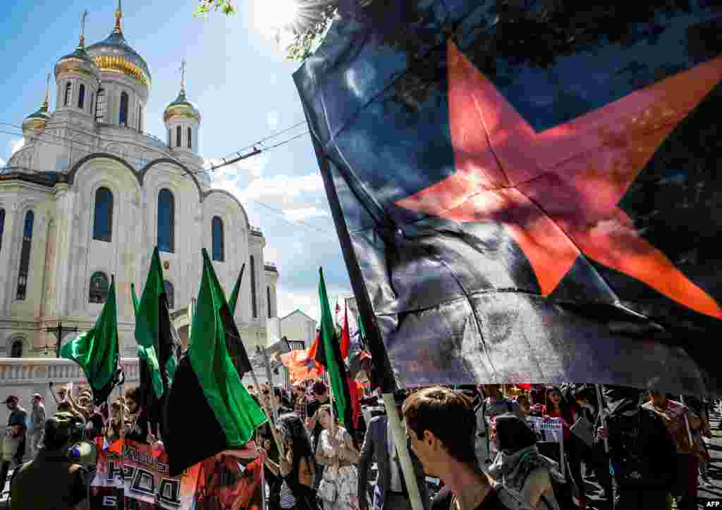 Members of Russian opposition parties take part in a march for a free Internet in central Moscow on July 23. The protest came amid a broad crackdown on online speech in recent years that rights activists say is targeting legitimate dissent under the pretext of battling extremism. (AFP/Mladen Antonov)