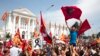 Macedonia - Protestors wave Macedonian and Albanian flags during a rally in front of the Government Building in Skopje, May 17,2015