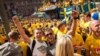 Polish fans Jacek (left) and Piotrek amid a sea of Swedish supporters during the Euro 2012 soccer championships in Kyiv on June 15.