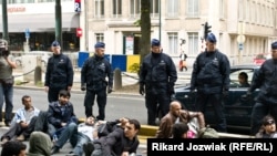 Afghan asylum seekers block a road in Brussels after being evicted from their shelter by Belgian police on June 16.