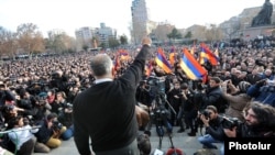 Armenian opposition leader Raffi Hovannisian gestures to the crowd at a rally in Liberty Square in Yerevan on February 20.