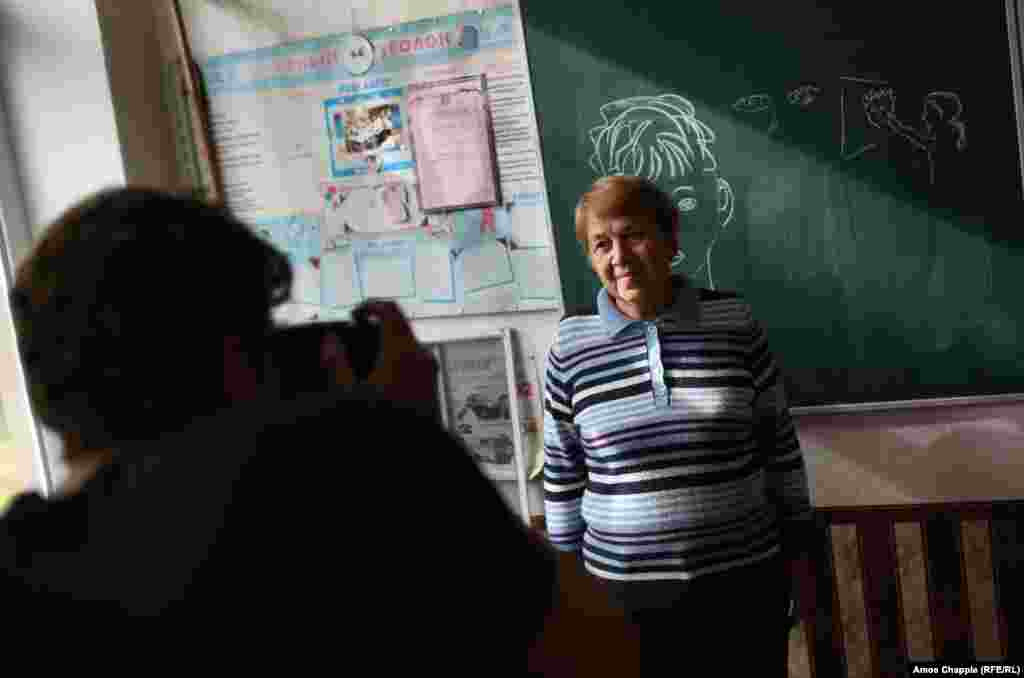 The day before, van Helten had visited a local school to photograph Marina Marchenko, whom he chose after seeing a photograph of the 73-year-old teacher. &quot;I could just see the kindness in her eyes...I want my work to have a local identity.&quot;