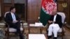 Afghan President Ashraf Ghani (right) meets with U.S. Defense Secretary Mark Esper in Kabul on October 20.