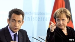 French President Nicolas Sarkozy (left) and German Chancellor Angela Merkel have both criticized Russia's actions, but in varying ways.