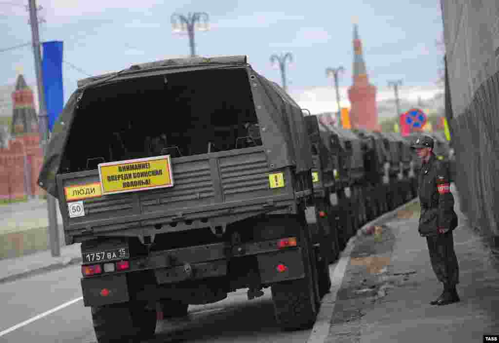 Police trucks are parked on Bolotnaya Square ahead of the protest.