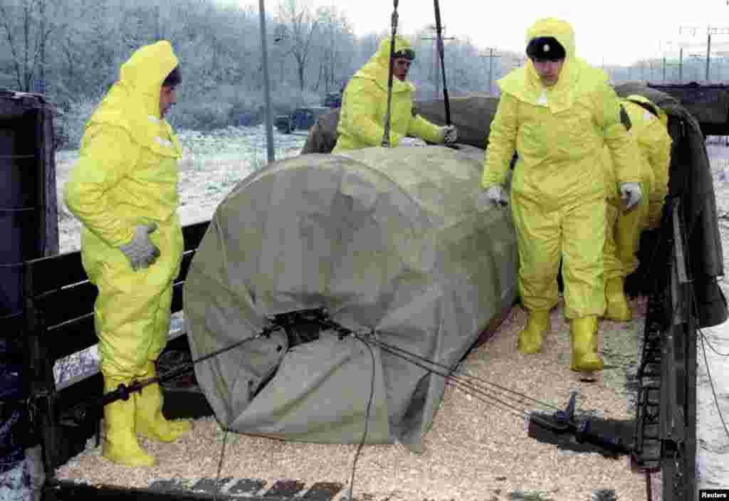 Soldiers practice transferring a nuclear warhead from a rail car onto a truck near the Ukrainian city of Kirovohrad on December 7, 1995. It was part of an exercise to train specialized personnel to cope with potential accidents during the transport of nuclear materials.