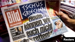 The German tabloid "Bild's" headline says: "Bye-bye, Greece. Today we won't be able to save you!" 