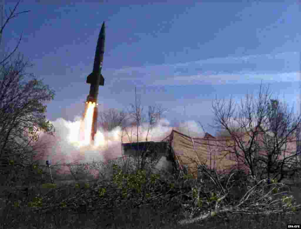 A Russian Tochka missile, capable of carrying half a ton of explosives, is launched towards a road used by Chechen rebels in November 1999. Russian forces fired several tactical ballistic missiles that slammed into central Grozny on October 21, killing more than 100 people instantly and sparking international outrage.