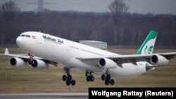 An Airbus A340-300 of of Iran's Mahan Air airline takes off from Duesseldorf airport, January 16, 2019 FILE PHOTO