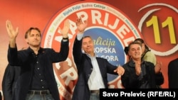 Veteran Montenegrin leader Milo Djukanovic (center) celebrates the win by his Coalition for European Montenegro.