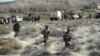 Afghanistan -- Members of the Afghan security services patrol following an operation against Islamic State militants (IS) in Achin district of Nangarhar province, Februaury 17, 2016