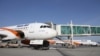 FILE: An Afghan Kam Air passenger jet is parked at Kabul International Airport.