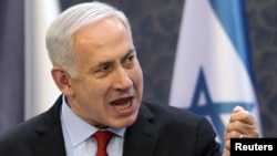 Israeli Prime Minister Benjamin Netanyahu gestures during a news conference in Prague.