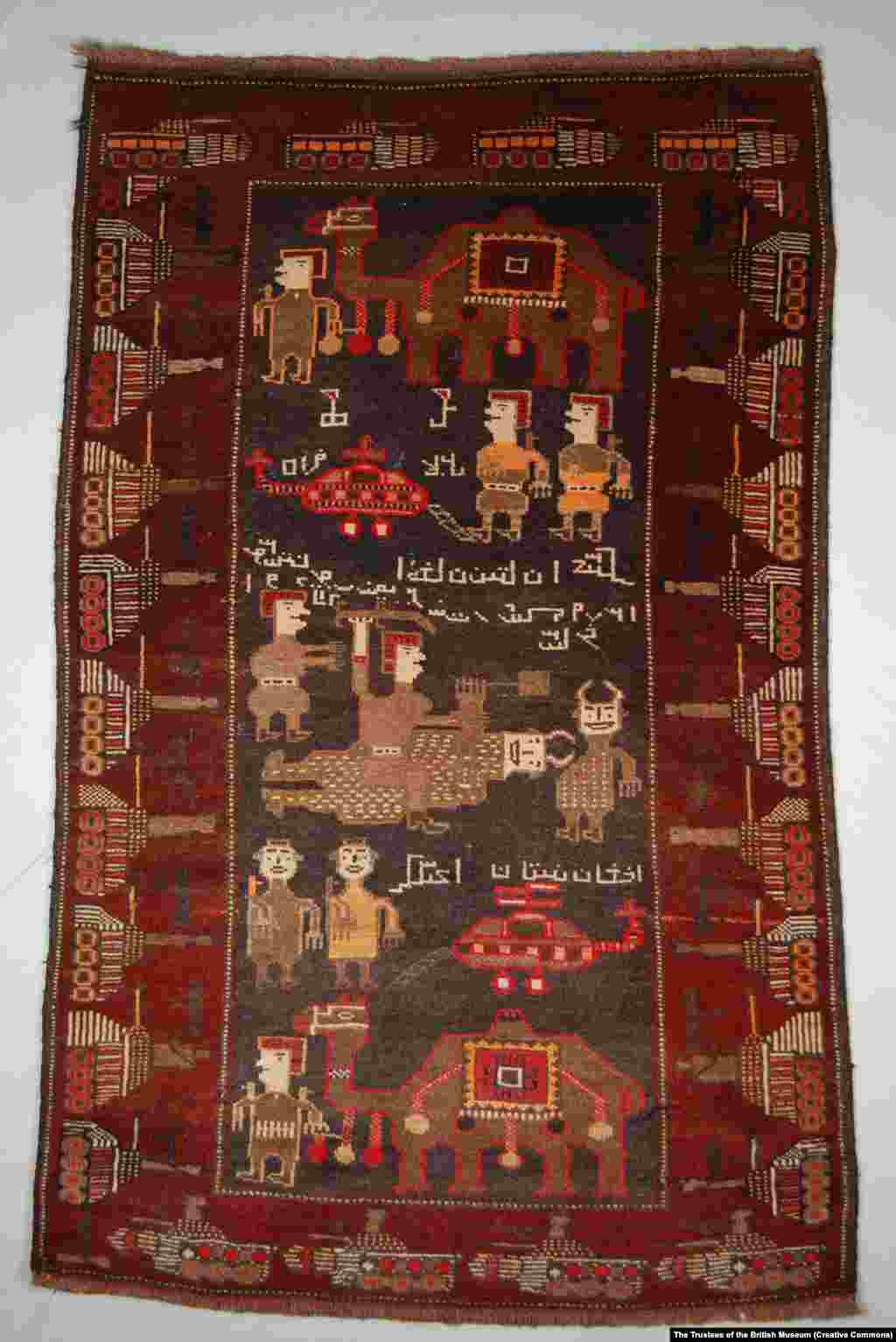 A rug centered around an illustration of Afghan fighters with camels killing Soviet soldiers. The foreign troops are depicted as horned devils. &nbsp; These rugs belong to the British Museum, which in late April made nearly 2 million photographs from its collections available for publication. More than a dozen war-themed Afghan rugs are held by the museum.